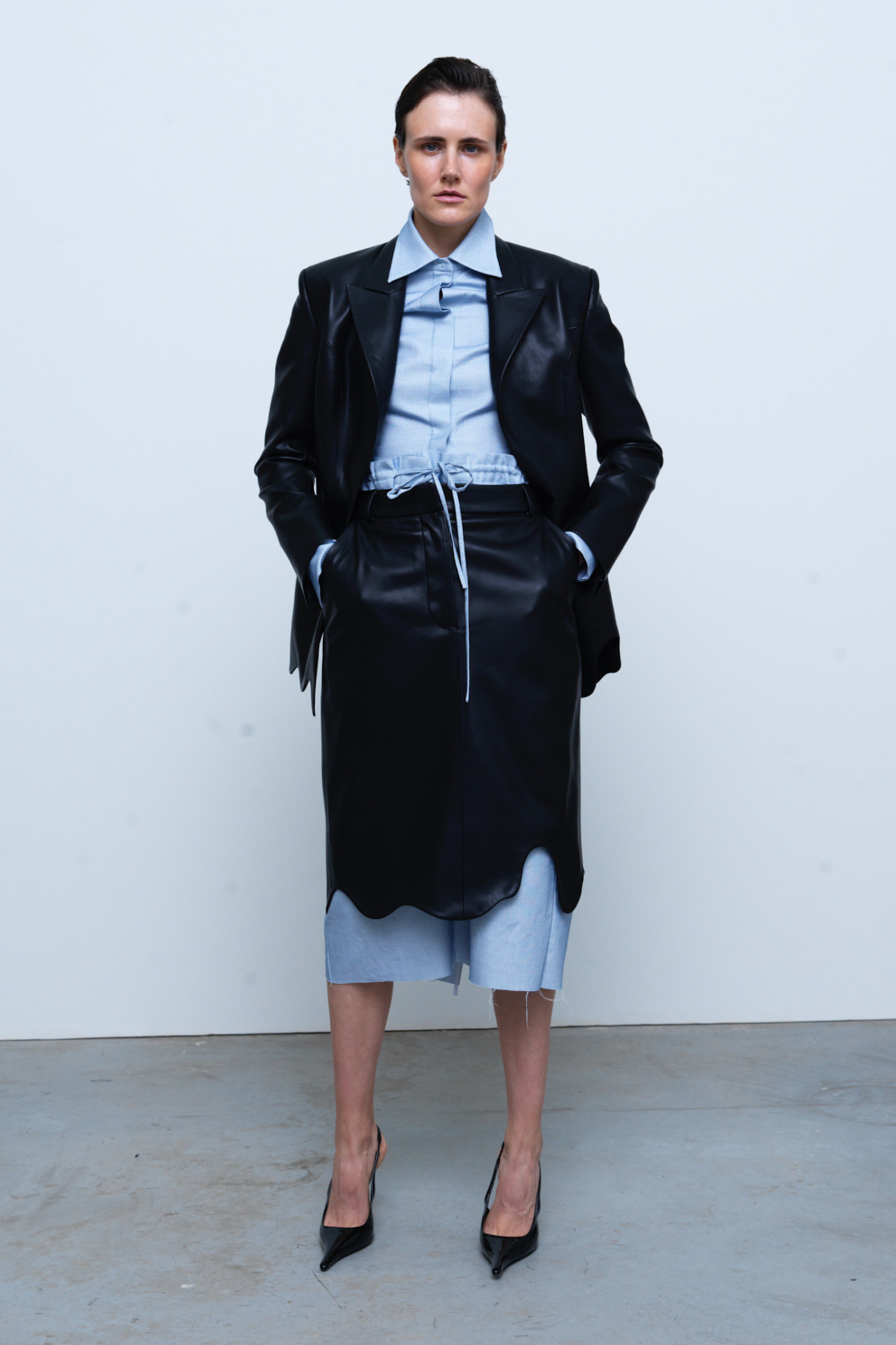SKIRT #03 — Faux Leather Wave Hem Midi Skirt GUDU