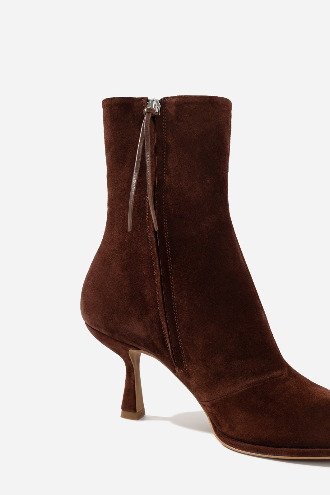 BLANCA dark brown suede ankle boots, close-up view of the side zipper and kitten heel