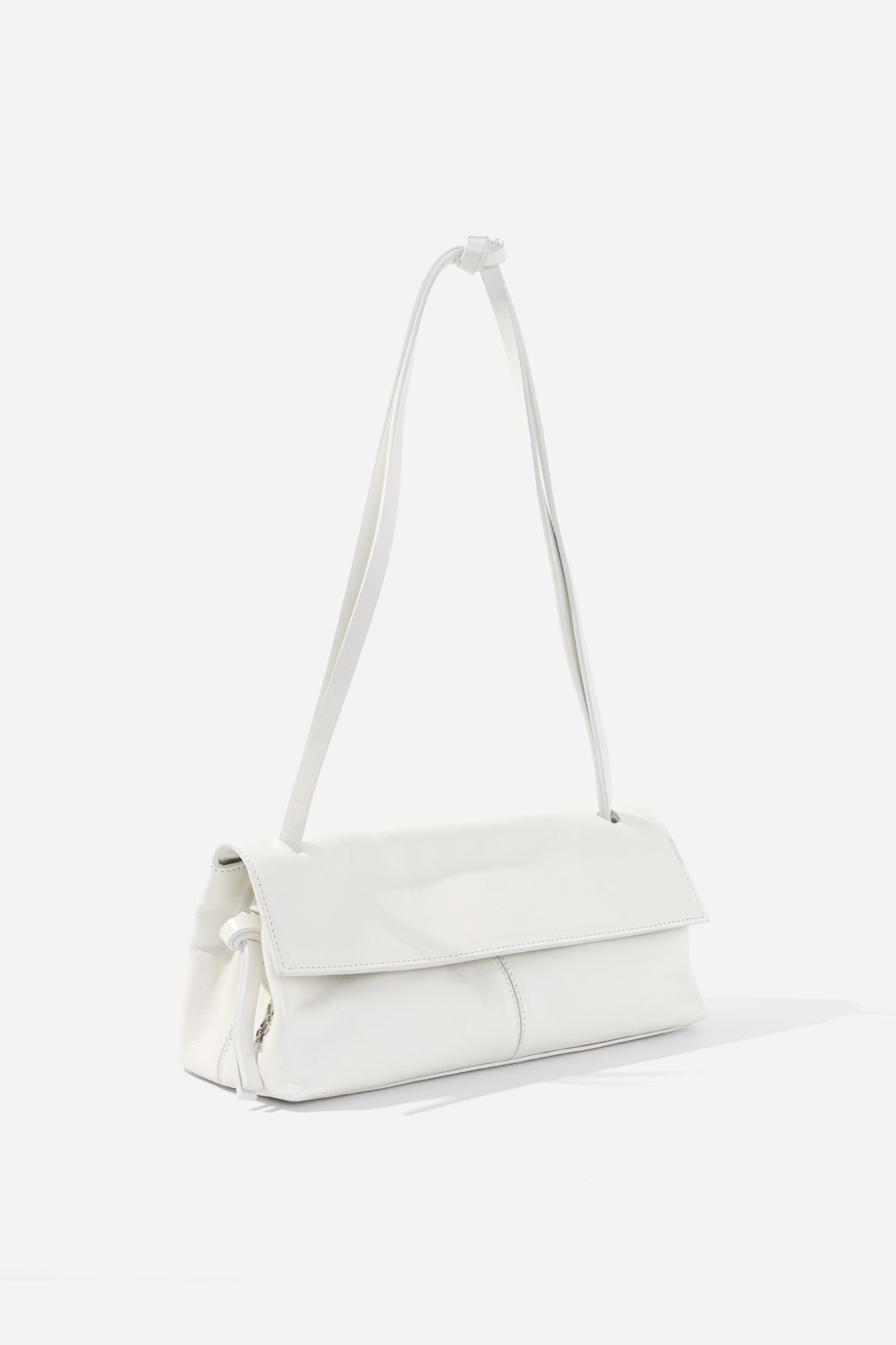 REBECCA BAGUETTE 29 white shimmering bag KACHOROVSKA, front 3/4 view with knot