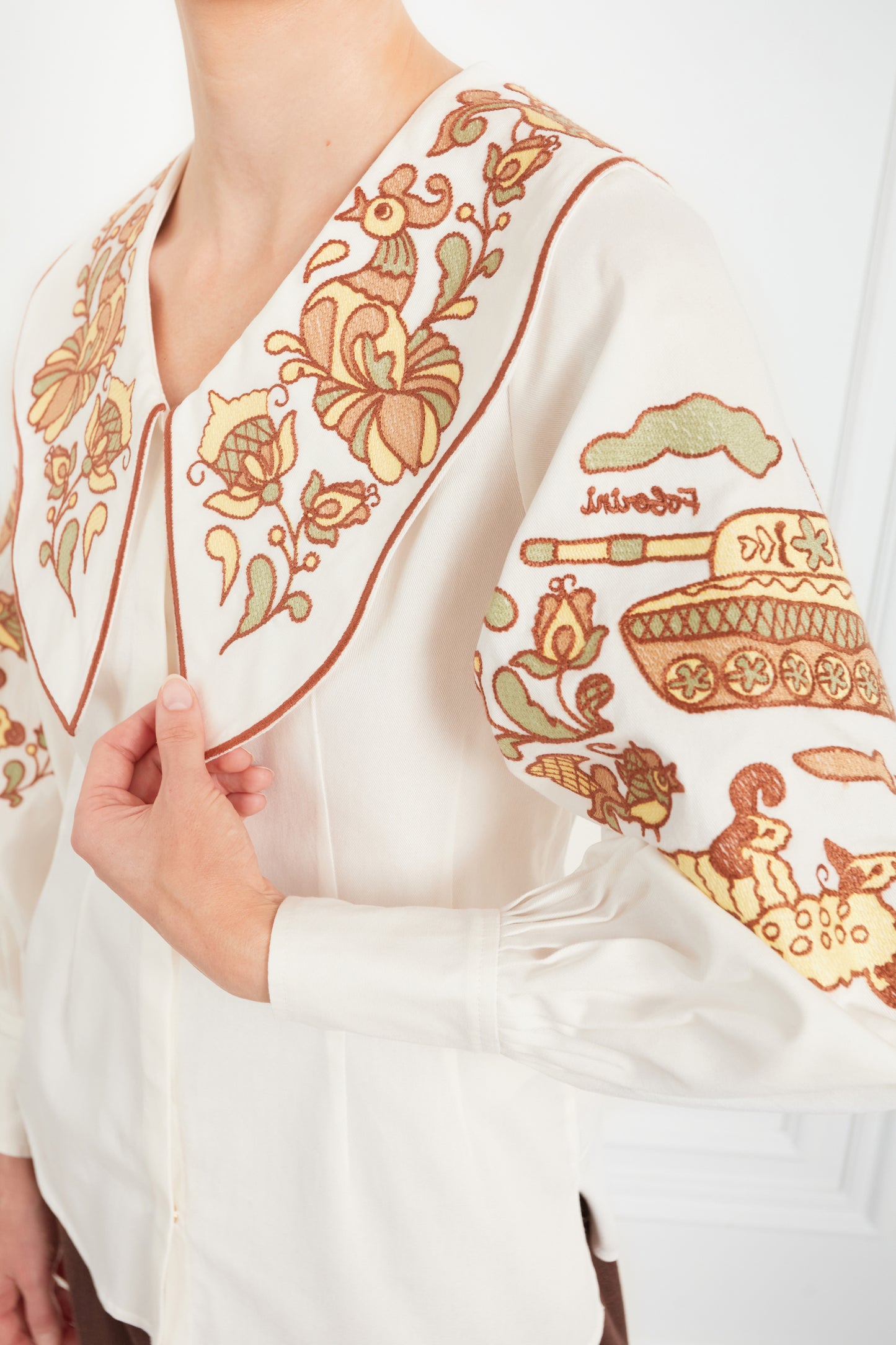 "Embroidery history" white blouse with colourful embroidery  FOBERINI